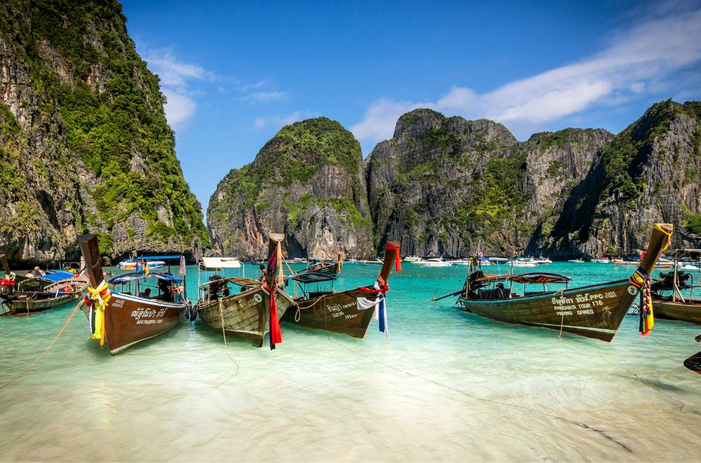 boats on a seashore during daytime